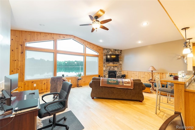 6312 S Graham Rd, Saint Charles, MI 48655 - office featuring wood walls, ceiling fan, wood finished floors, lofted ceiling, and a fireplace