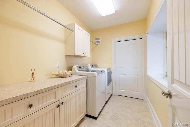 6312 S Graham Rd, Saint Charles, MI 48655 - laundry room with washer and clothes dryer, cabinet space, and baseboards