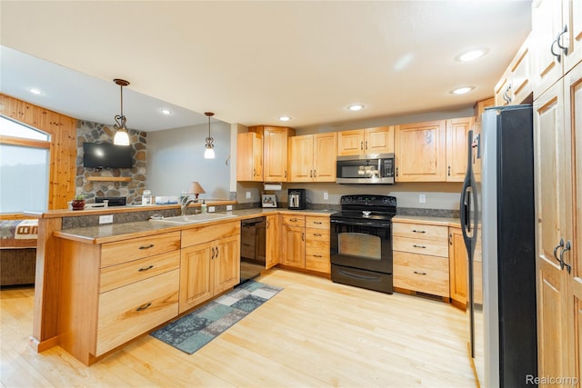 6312 S Graham Rd, Saint Charles, MI 48655 - kitchen featuring black appliances, a sink, light brown cabinetry, a peninsula, and tile counters