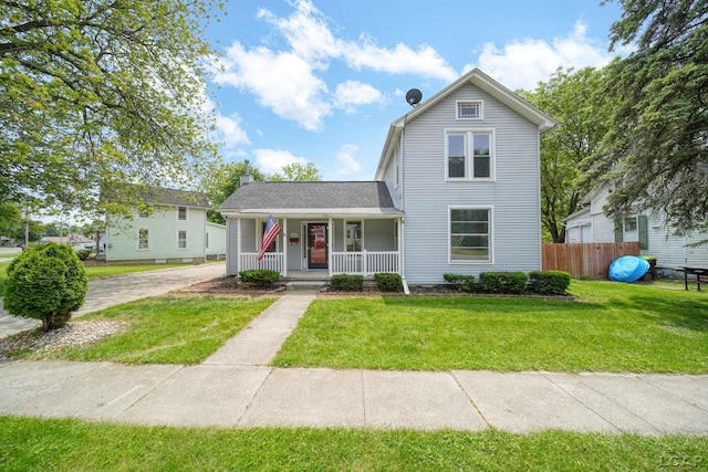 603 Company St, Adrian, MI 49221 - traditional home with covered porch and a chimney