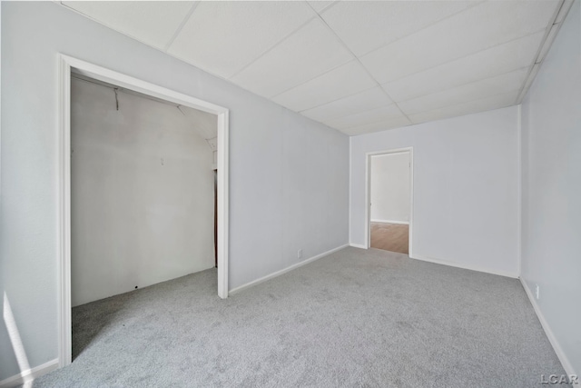603 Company St, Adrian, MI 49221 - unfurnished bedroom with carpet, a drop ceiling, and a closet