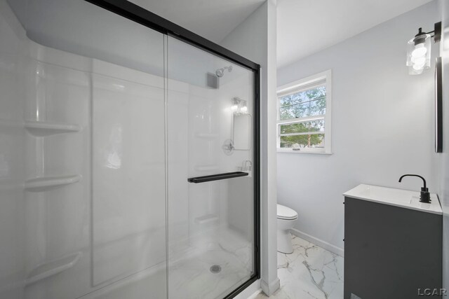 603 Company St, Adrian, MI 49221 - full bathroom with marble look tile flooring, a shower stall, and toilet
