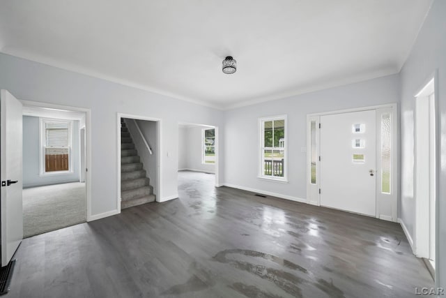 603 Company St, Adrian, MI 49221 - foyer entrance with stairway, dark wood-style flooring, and baseboards