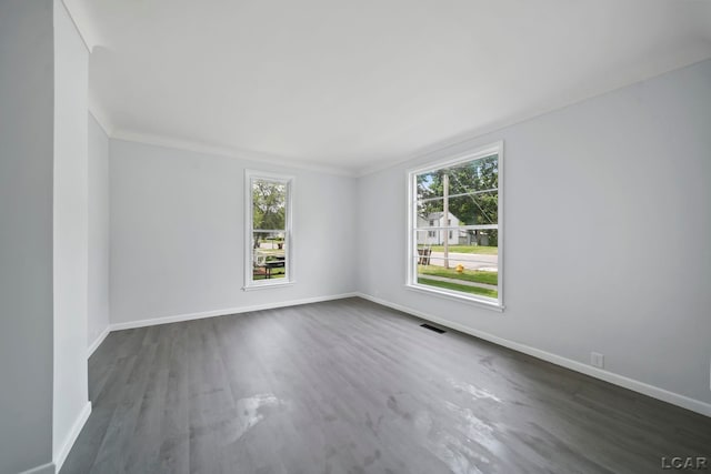 603 Company St, Adrian, MI 49221 - empty room featuring baseboards and dark wood finished floors