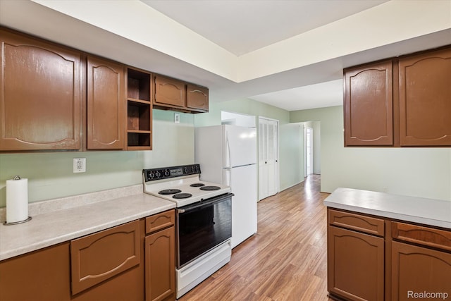 229 Hillview Ter, Fenton, MI 48430 - kitchen with electric range, freestanding refrigerator, light countertops, and light wood finished floors