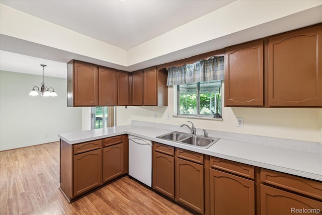 229 Hillview Ter, Fenton, MI 48430 - kitchen featuring white dishwasher, a peninsula, a chandelier, and light countertops