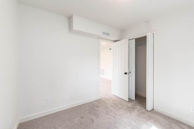 607 S Mill St, Saint Louis, MI 48880 - unfurnished bedroom featuring carpet, baseboards, and a closet