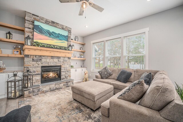 1749 Fairview Dr, Allegan, MI 49010 - living area featuring a fireplace, a ceiling fan, wood finished floors, and recessed lighting