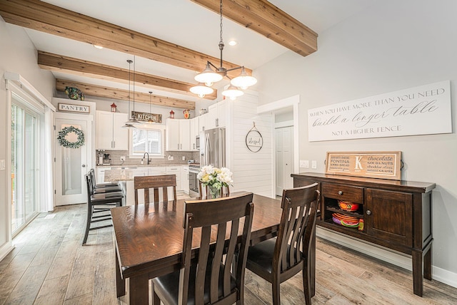 1749 Fairview Dr, Allegan, MI 49010 - dining area featuring beam ceiling, light wood-style floors, and recessed lighting