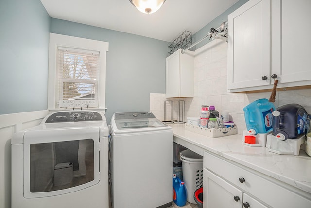 1749 Fairview Dr, Allegan, MI 49010 - laundry area featuring washing machine and dryer and cabinet space