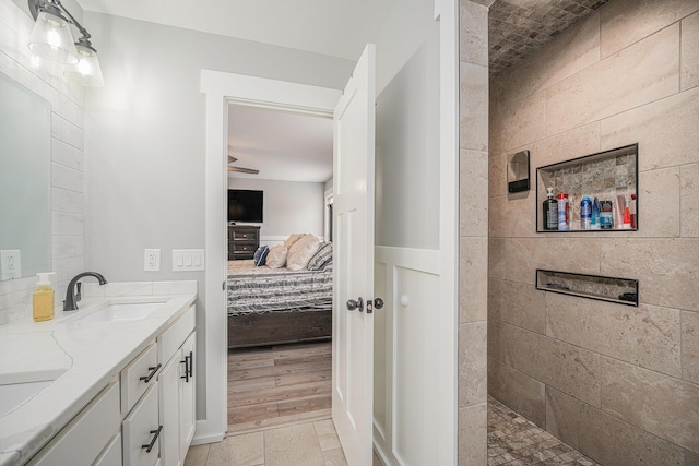 1749 Fairview Dr, Allegan, MI 49010 - bathroom featuring ensuite bathroom, double vanity, a ceiling fan, and a walk in shower