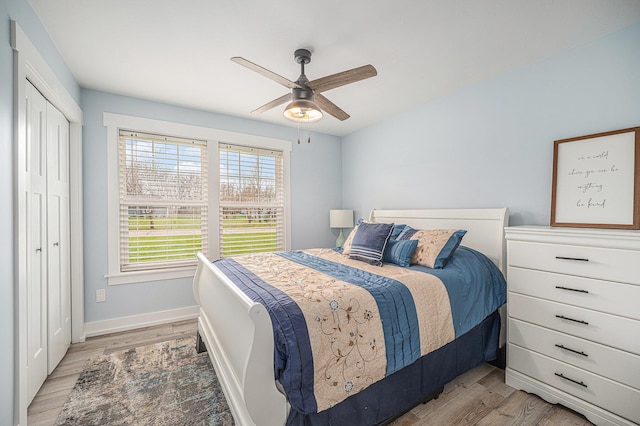 1749 Fairview Dr, Allegan, MI 49010 - bedroom with light wood-style flooring, baseboards, a closet, and a ceiling fan