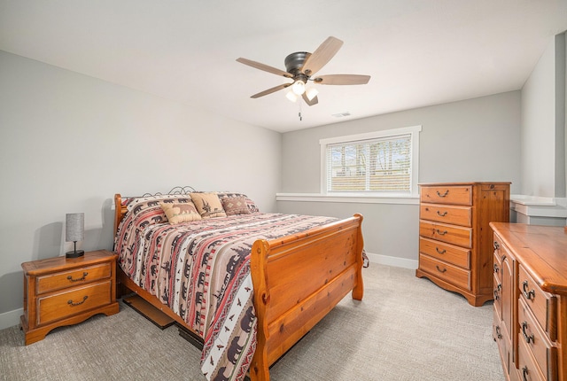 1749 Fairview Dr, Allegan, MI 49010 - bedroom with light carpet, baseboards, and ceiling fan