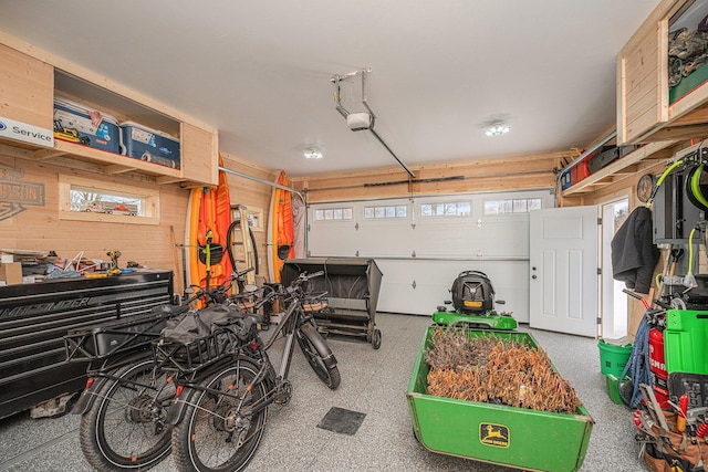 1749 Fairview Dr, Allegan, MI 49010 - garage with a garage door opener and wooden walls