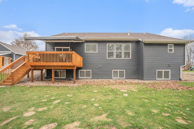 1749 Fairview Dr, Allegan, MI 49010 - back of property featuring a wooden deck, a yard, and stairway
