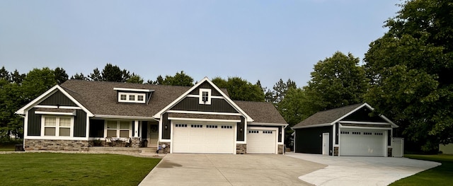 1749 Fairview Dr, Allegan, MI 49010 - craftsman inspired home featuring stone siding, a front lawn, a garage, and driveway