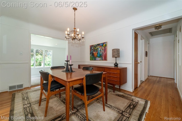 16926 Beverly Rd, Beverly Hills, MI 48025 - dining space featuring light wood-style flooring, a chandelier, and baseboards