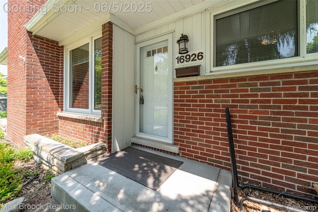 16926 Beverly Rd, Beverly Hills, MI 48025 - view of exterior entry with a porch and brick siding