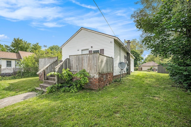 64 E Grand Circle Ave, Battle Creek, MI 49037 - back of house with a chimney and a deck