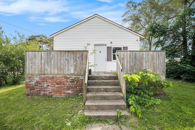 64 E Grand Circle Ave, Battle Creek, MI 49037 - rear view of house with a lawn