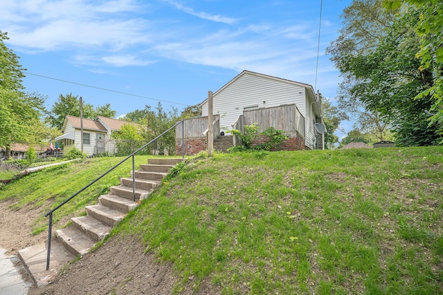 64 E Grand Circle Ave, Battle Creek, MI 49037 - view of yard featuring stairway and a wooden deck