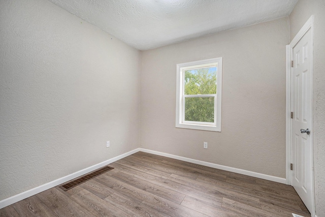 64 E Grand Circle Ave, Battle Creek, MI 49037 - empty room with wood finished floors and baseboards