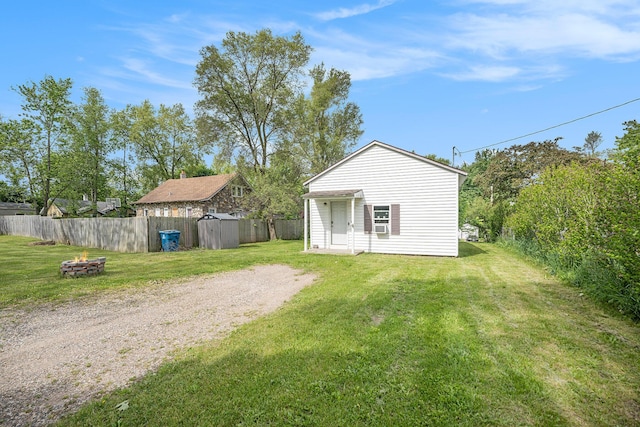 64 E Grand Circle Ave, Battle Creek, MI 49037 - exterior space featuring an outdoor fire pit and an outdoor structure
