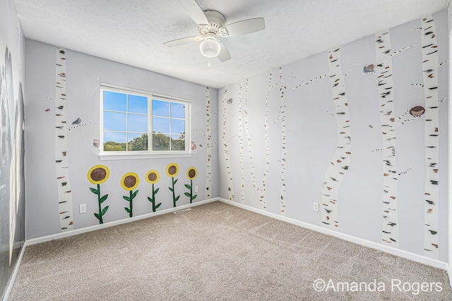 648 Firestone Dr SE, Byron Center, MI 49315 - empty room featuring carpet, ceiling fan, a textured ceiling, and baseboards