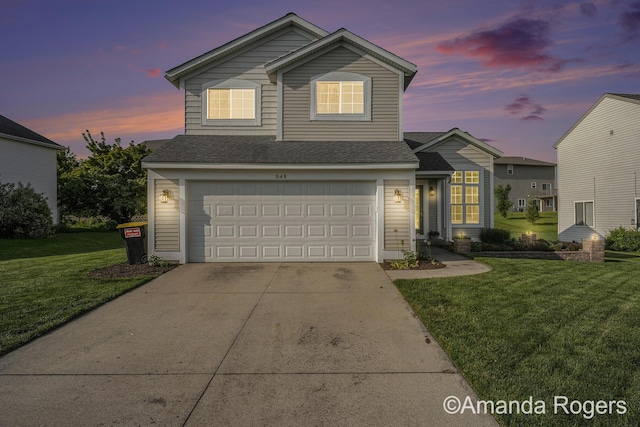 648 Firestone Dr SE, Byron Center, MI 49315 - traditional home featuring driveway, a front lawn, an attached garage, and a shingled roof