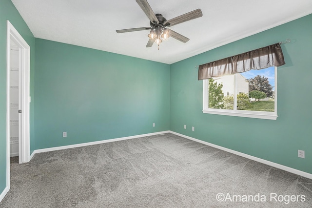 648 Firestone Dr SE, Byron Center, MI 49315 - carpeted empty room featuring a ceiling fan and baseboards