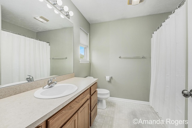 648 Firestone Dr SE, Byron Center, MI 49315 - bathroom featuring vanity, toilet, and baseboards