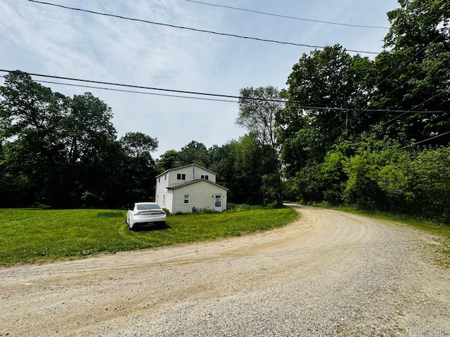 9617 Portage Trl, White Lake, MI 48386 - view of dirt / gravel road