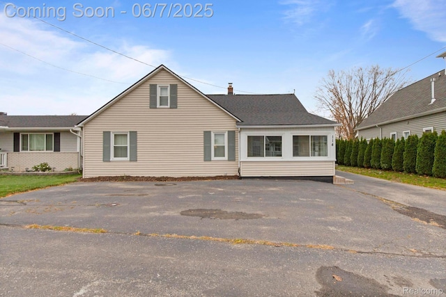 114 Interlochen Dr, Algonac, MI 48001 - back of property featuring a chimney