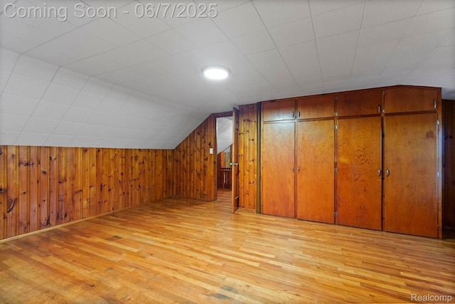 114 Interlochen Dr, Algonac, MI 48001 - additional living space with light wood-style flooring, wood walls, and lofted ceiling