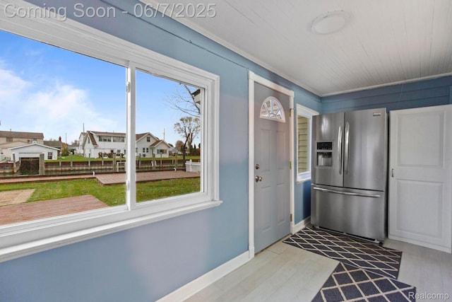 114 Interlochen Dr, Algonac, MI 48001 - kitchen featuring stainless steel fridge with ice dispenser, plenty of natural light, light wood-style flooring, and baseboards