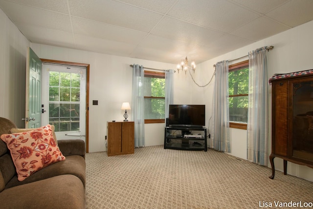1819 Willis Ave NW, Grand Rapids, MI 49504 - carpeted living room with a chandelier, healthy amount of natural light, and a paneled ceiling