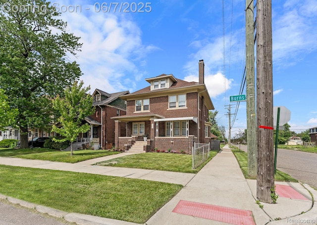 5302 Burns St, Detroit, MI 48213 - traditional style home featuring a chimney, brick siding, a front lawn, and central AC