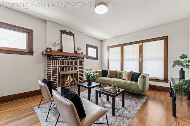 5302 Burns St, Detroit, MI 48213 - living area with baseboards, a fireplace, light wood finished floors, and ornamental molding