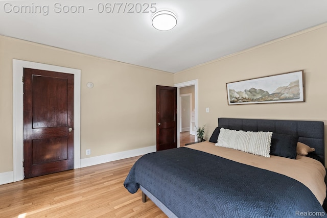 5302 Burns St, Detroit, MI 48213 - bedroom featuring light wood-type flooring, ornamental molding, and baseboards