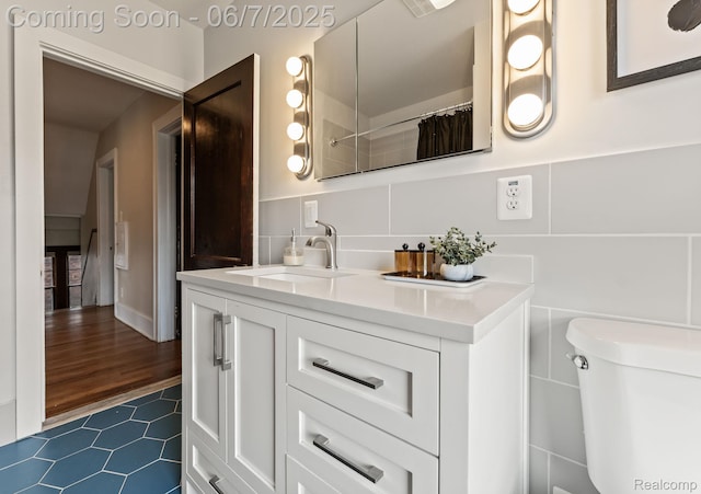 5302 Burns St, Detroit, MI 48213 - bathroom with vanity, tile patterned flooring, and toilet