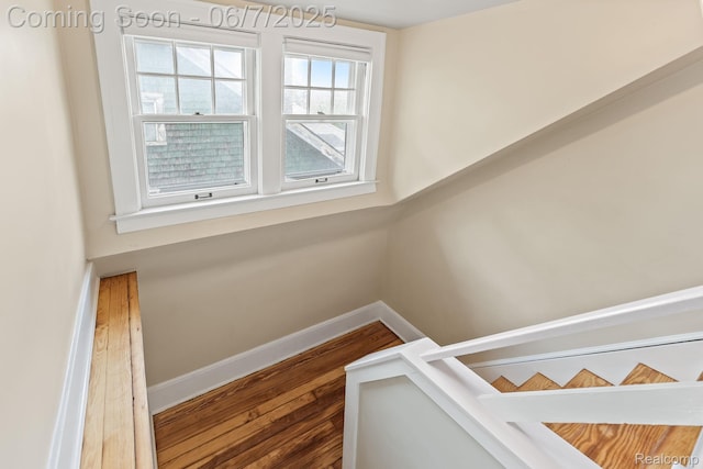 5302 Burns St, Detroit, MI 48213 - stairway with baseboards and wood finished floors