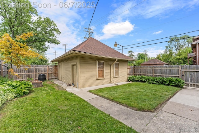 5302 Burns St, Detroit, MI 48213 - rear view of property with roof with shingles