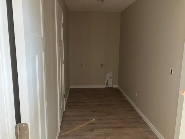 F Walton Rd, Kingsley, MI 49649 - washroom with wood finished floors and baseboards