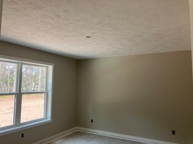 F Walton Rd, Kingsley, MI 49649 - empty room with a textured ceiling and baseboards