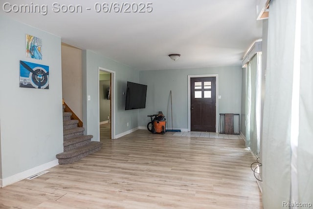 923 Stone St, Port Huron, MI 48060 - foyer entrance featuring light wood-type flooring, baseboards, and stairs