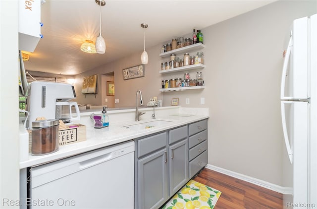 12267 Saint Andrews Way, Fenton, MI 48430 - kitchen featuring gray cabinetry, a sink, white appliances, dark wood-style floors, and light countertops