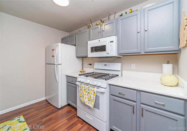 12267 Saint Andrews Way, Fenton, MI 48430 - kitchen featuring white appliances, gray cabinetry, dark wood finished floors, light countertops, and baseboards