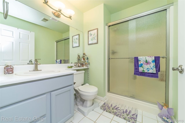 12267 Saint Andrews Way, Fenton, MI 48430 - full bathroom featuring vanity, tile patterned floors, a shower stall, and toilet