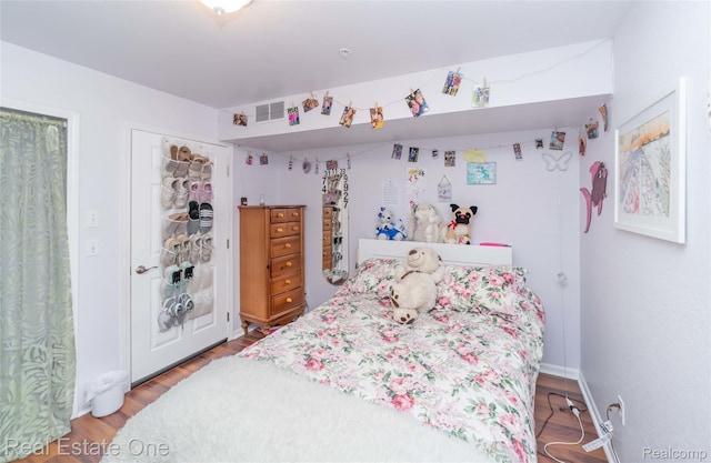 12267 Saint Andrews Way, Fenton, MI 48430 - bedroom featuring wood finished floors and baseboards