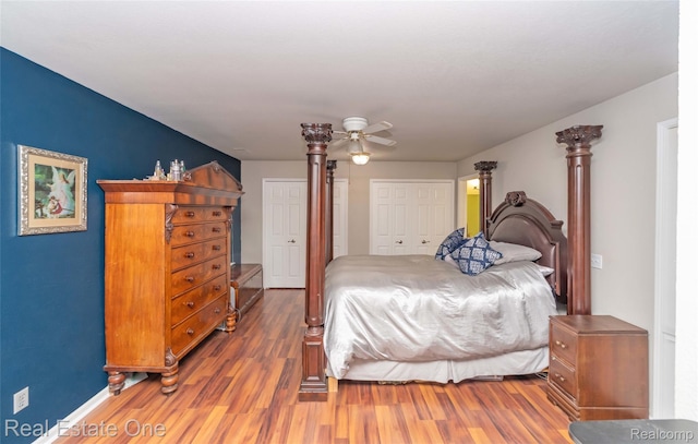 12267 Saint Andrews Way, Fenton, MI 48430 - bedroom featuring wood finished floors, a ceiling fan, and baseboards